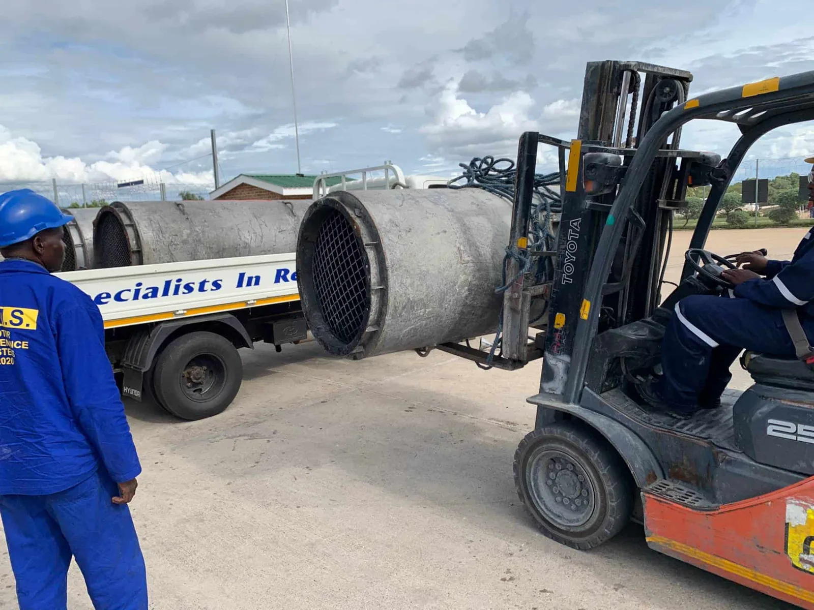 MMS Rewind Division technicians handling industrial motor equipment in Bulawayo